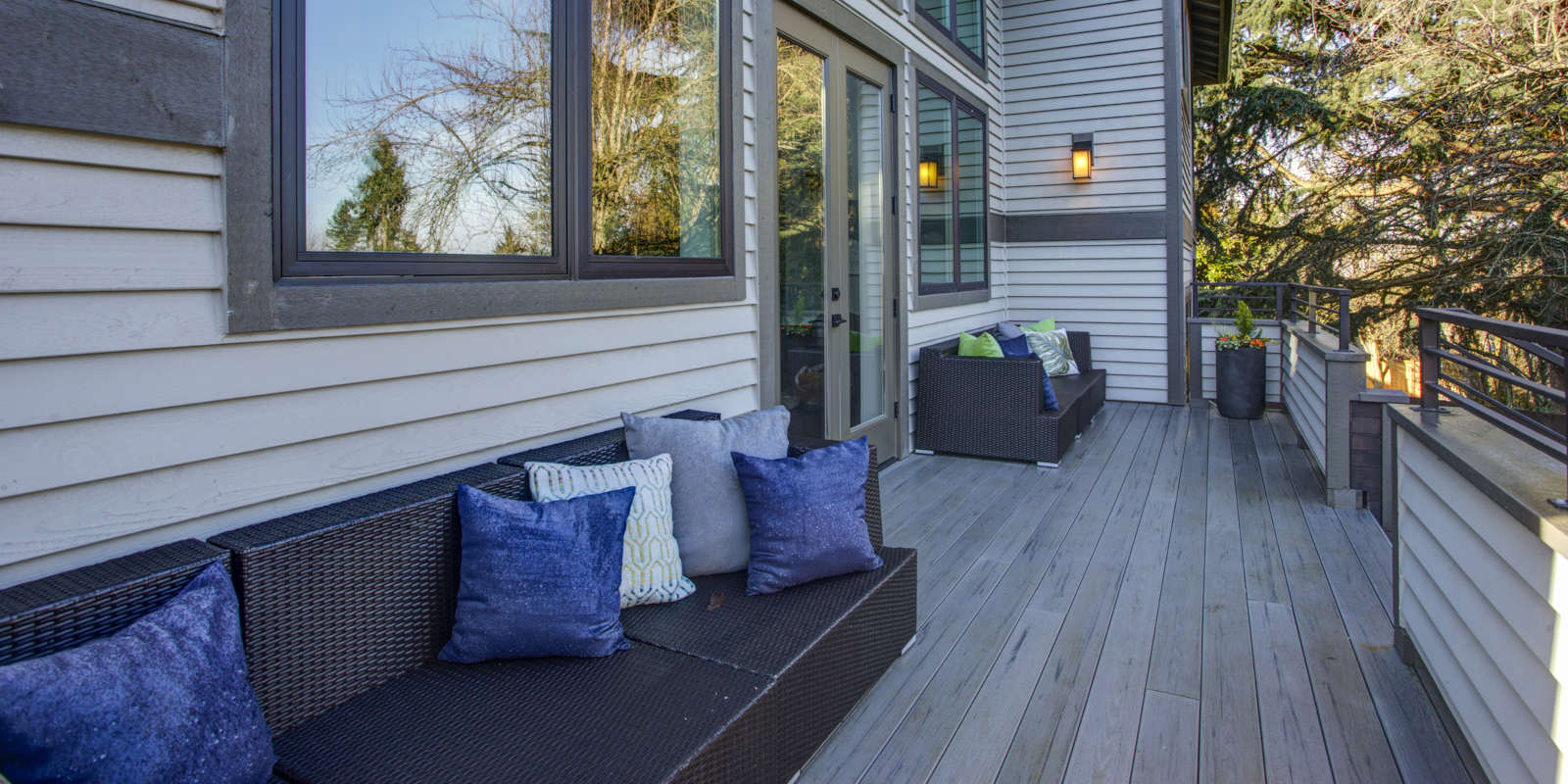 New construction home exterior boasts luxury deck Service Areas